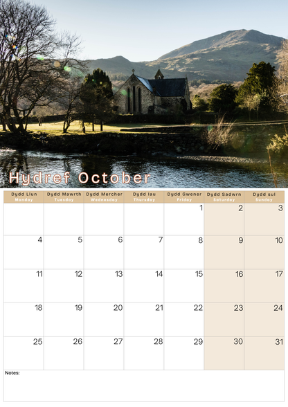 Calendar with a scenic landscape of a church and mountains, featuring the month of October.