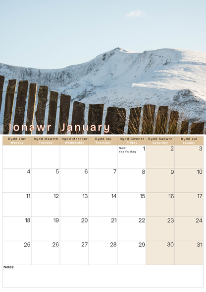 Calendar with a snowy mountain and wooden fence design, featuring the month of January.