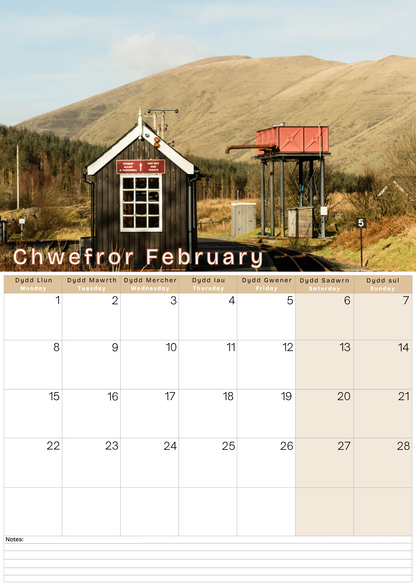 Calendar for February with a scenic landscape and building.