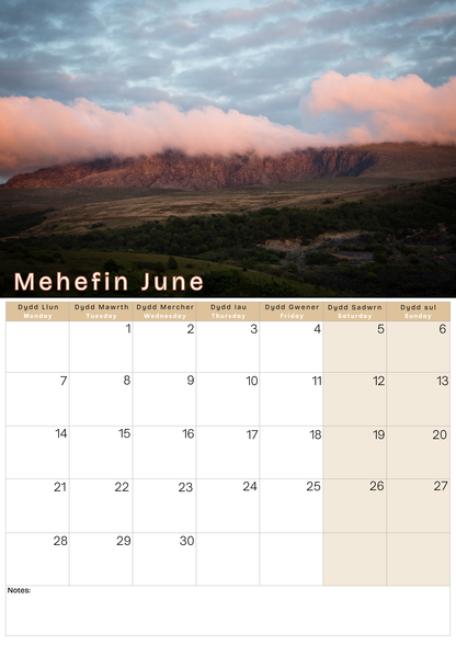 Calendar for June with a scenic mountain sunset landscape 