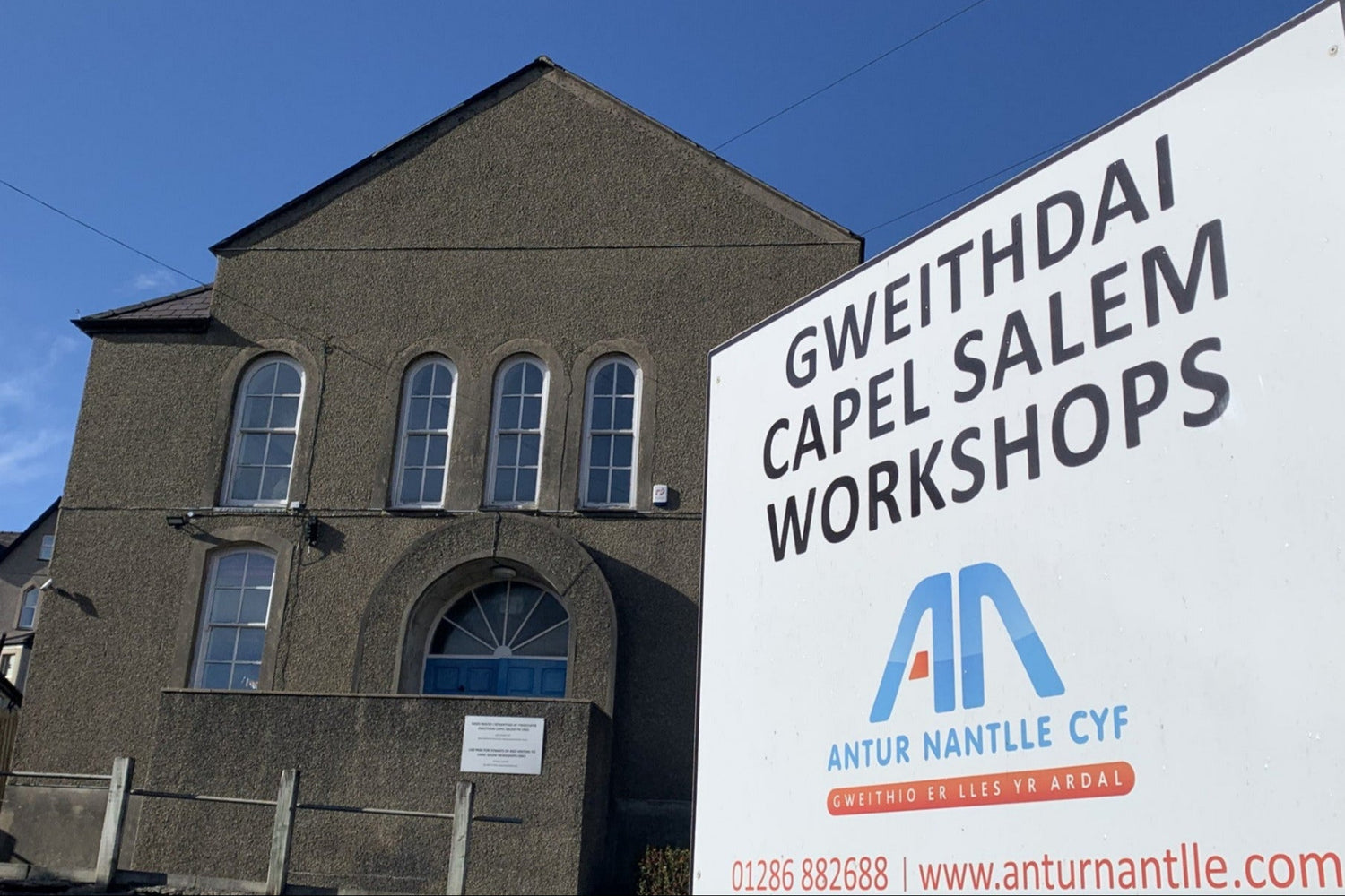 Building with a sign for Gweithdai Capel Salem Workshops in front