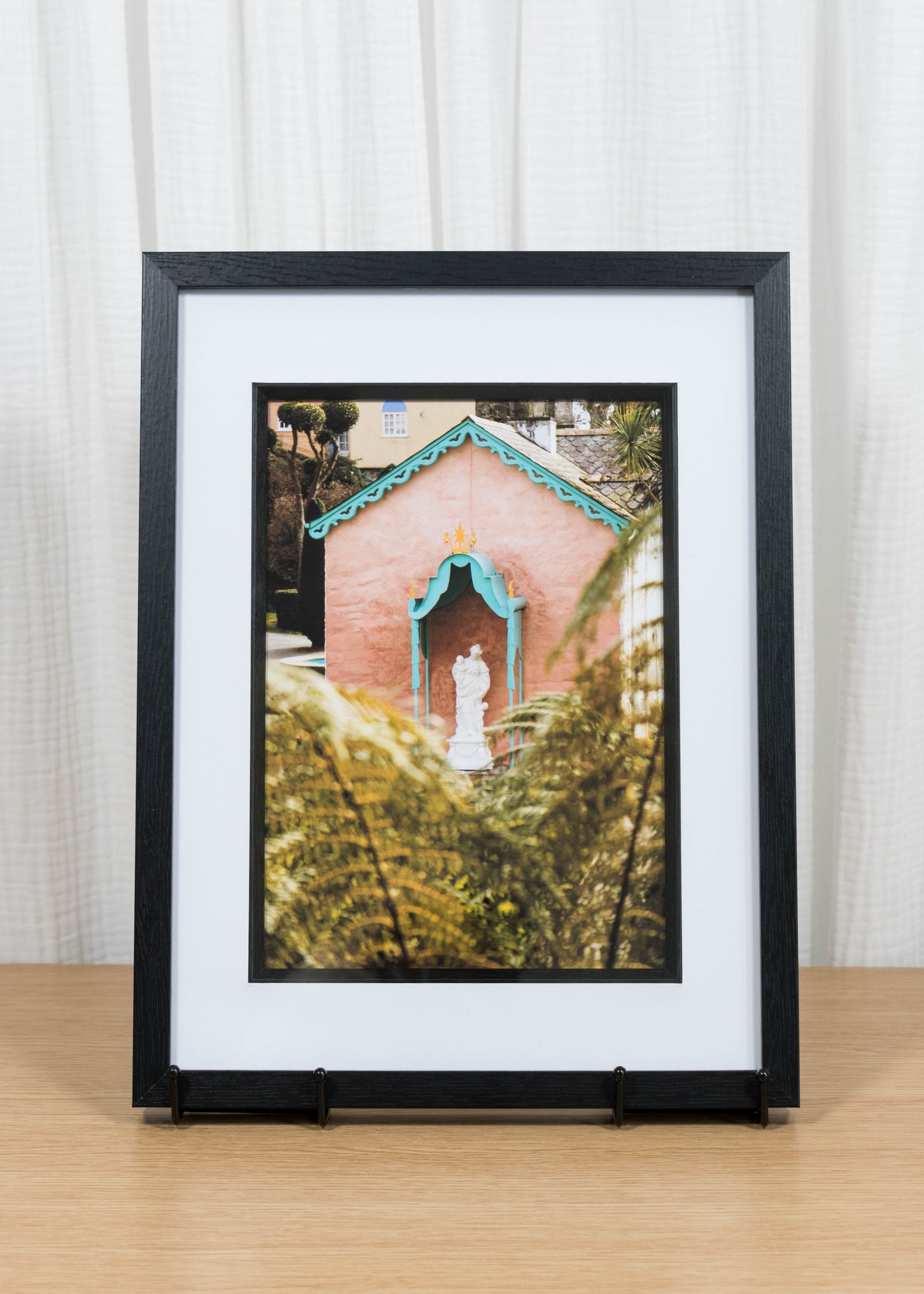 Statue through the ferns framed print