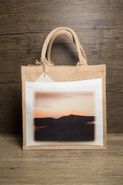 Jute bag with a sunset mountain landscape